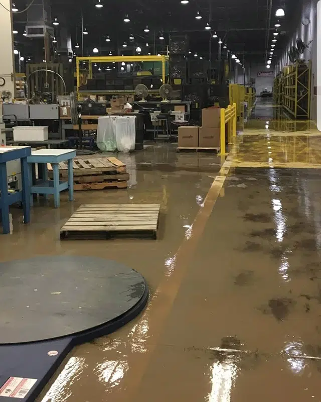 Stover's Restoration crew running commercial water extraction equipment on a job